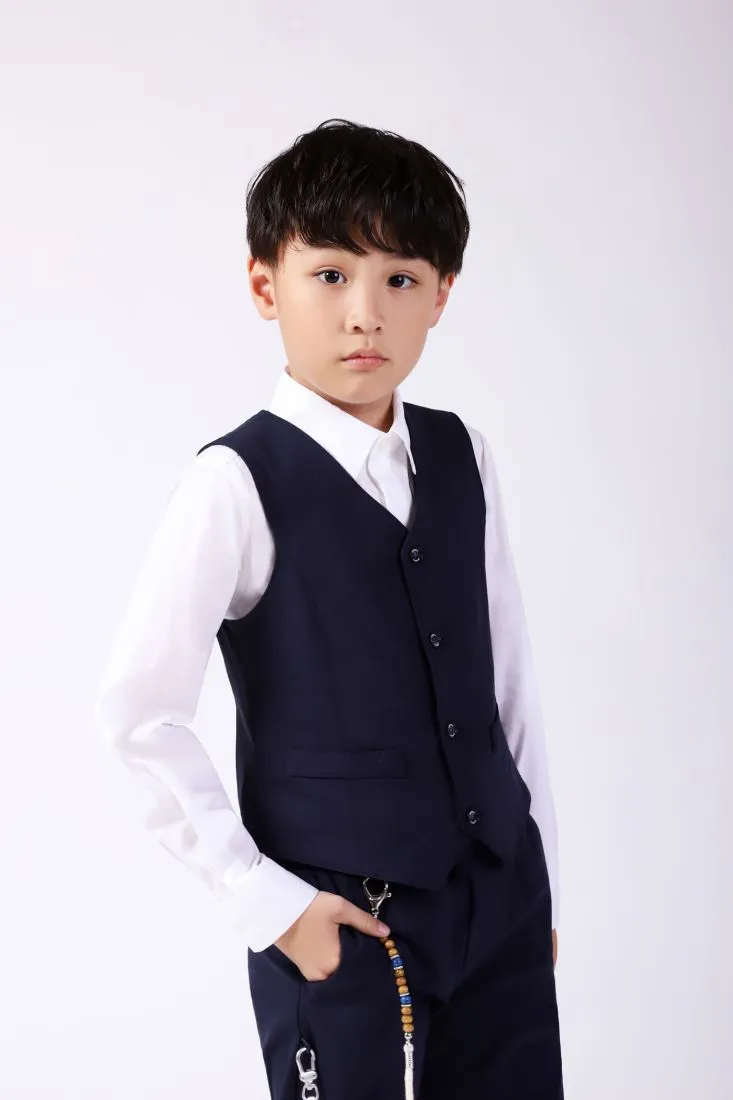 Gilet bambino monocolour con taschini a filetto