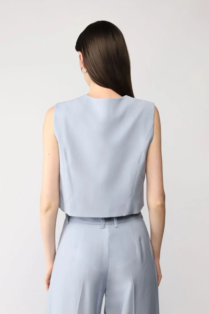 Gilet cropped monocolour con tasca a filetto