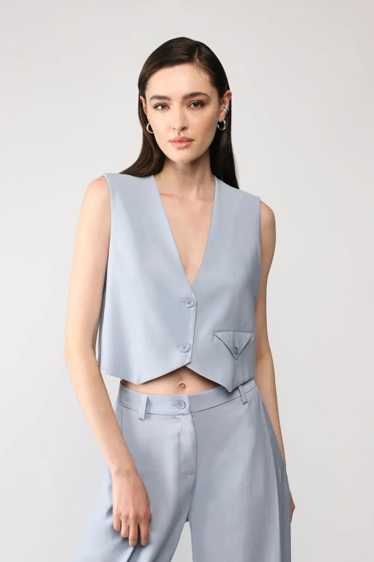 Gilet cropped monocolour con tasca a filetto