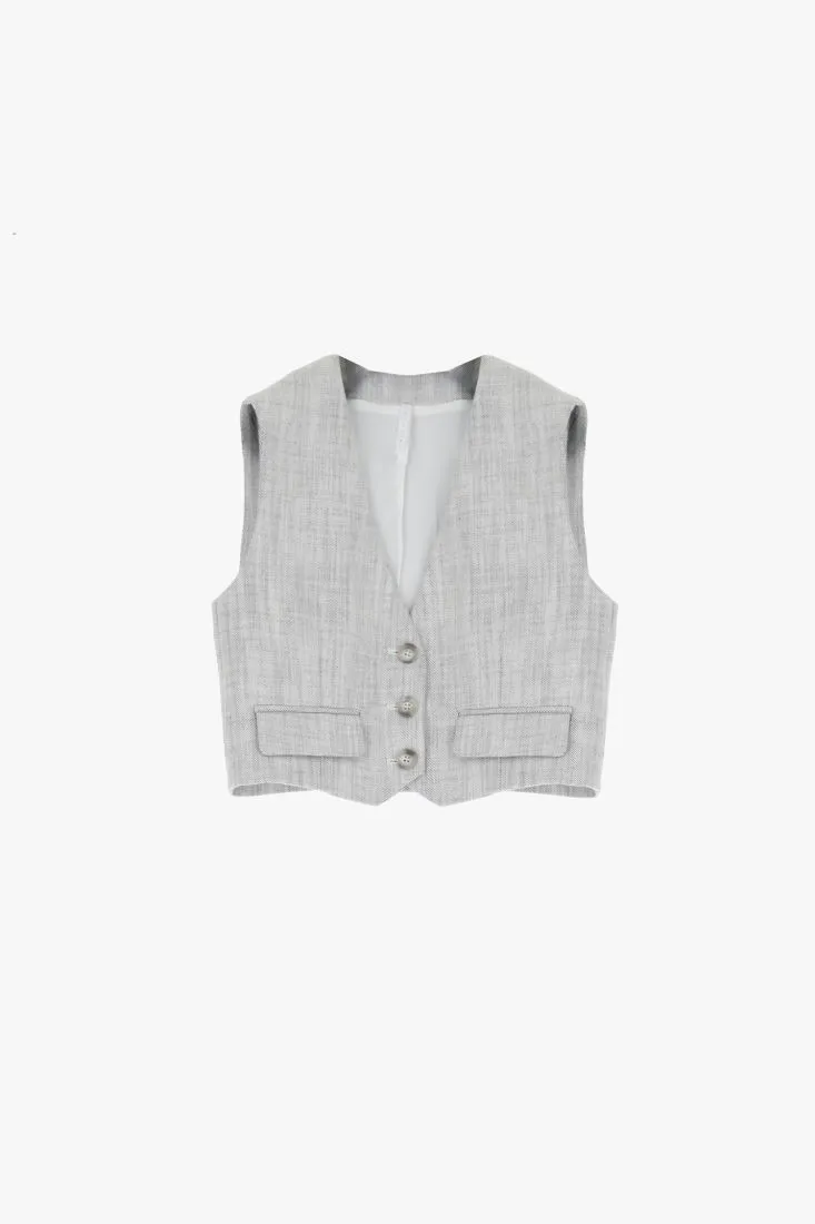 Gilet monopetto effetto denim con tasche asimmetriche