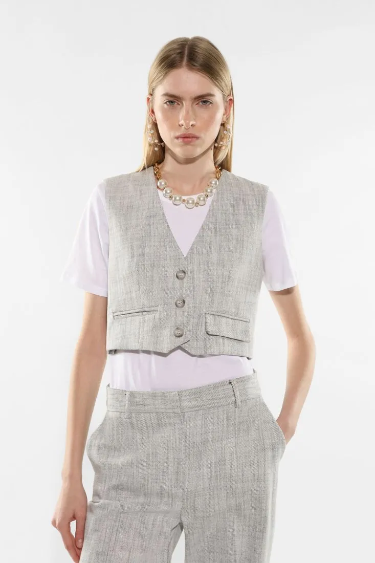 Gilet monopetto effetto denim con tasche asimmetriche