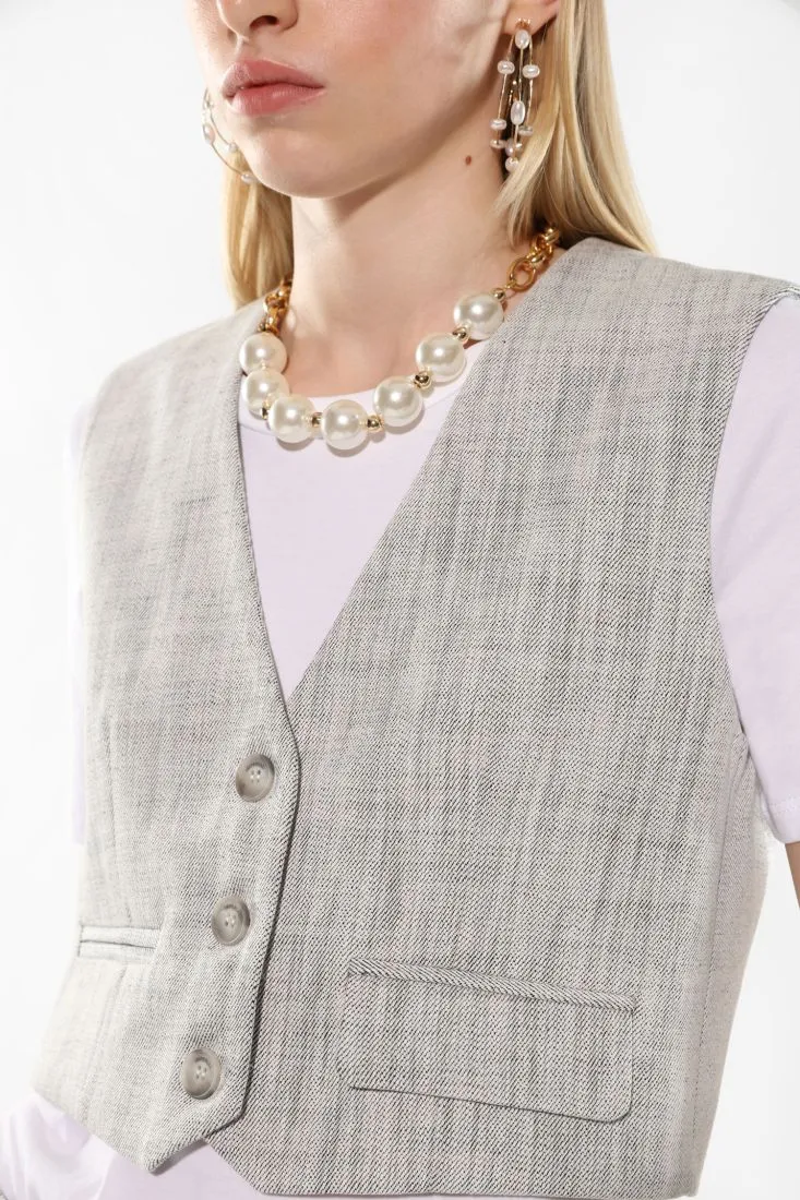 Gilet monopetto effetto denim con tasche asimmetriche