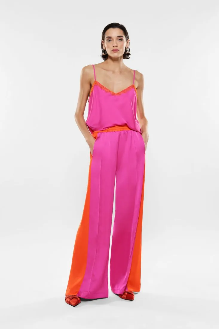 Pantaloni a palazzo fantasia bicolor con piega stirata