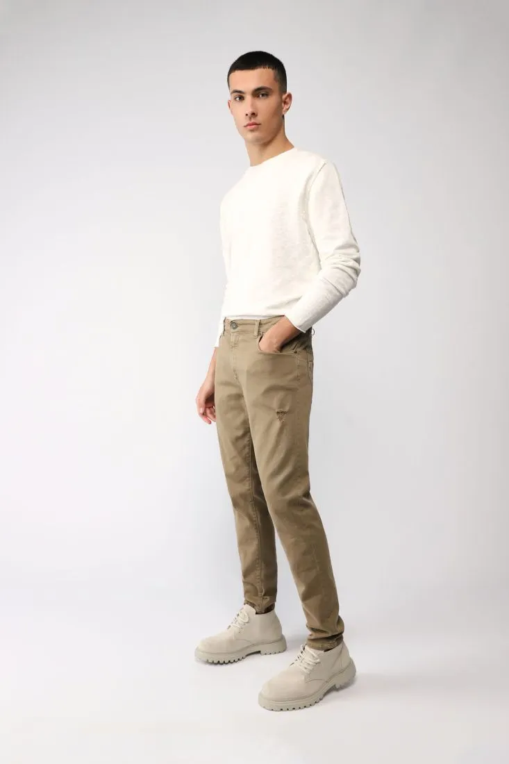 Pantaloni slim cropped monocolour con abrasioni