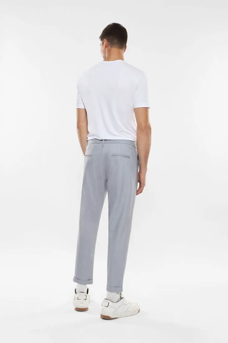 Pantaloni slim-fit effetto denim con tasche verticali
