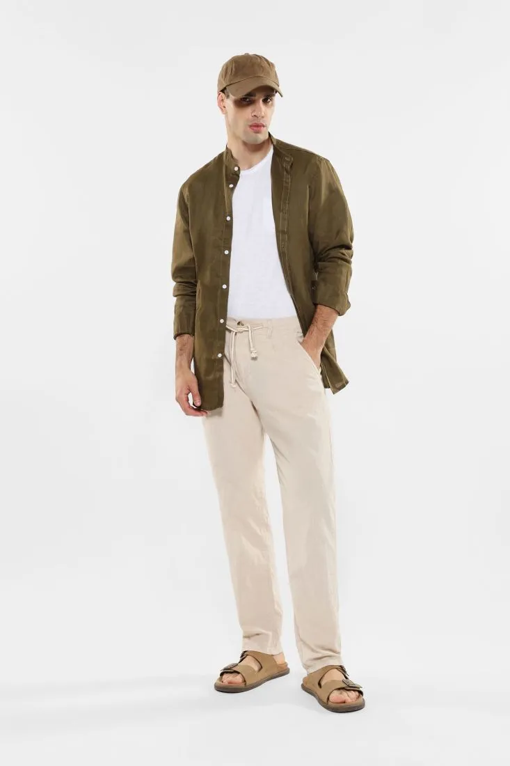 Pantaloni slim-fit in puro cotone con coulisse e pinces